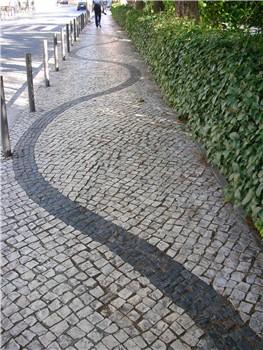 Sinuous lines in a Lisbon pavement