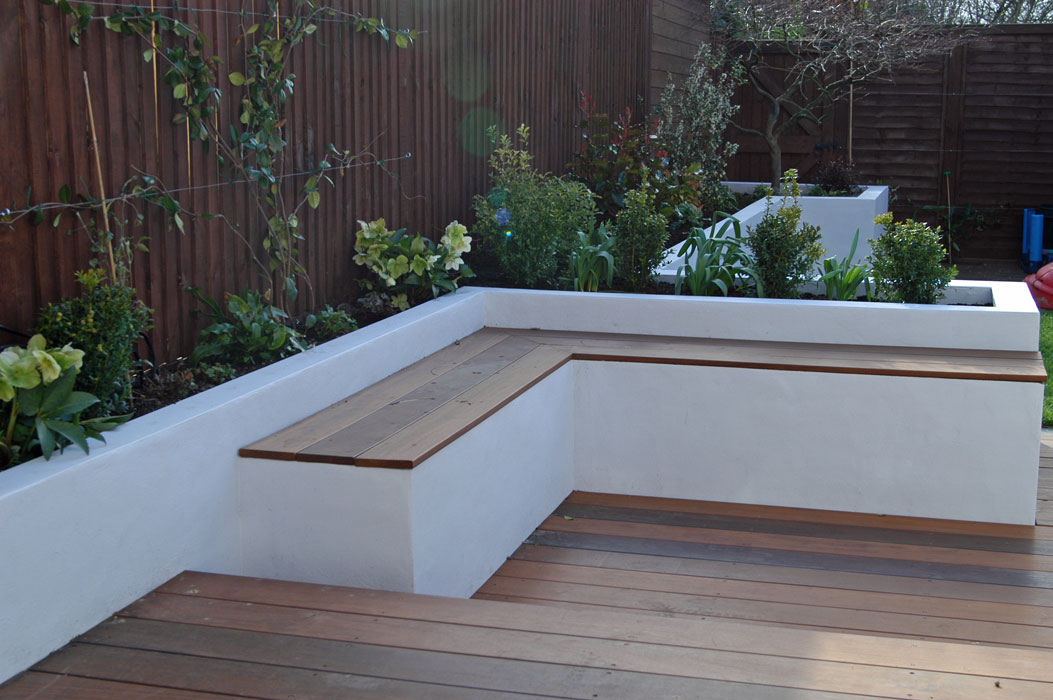 Raised beds and bench in small Ealing garden
