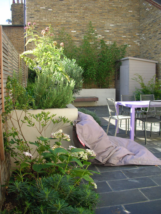 Sunny back garden in Acton with built in bench